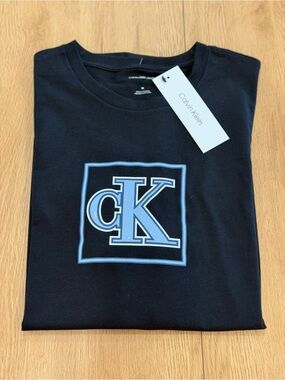 Calvin Klein Black T-Shirt with Light Blue CK Emblem